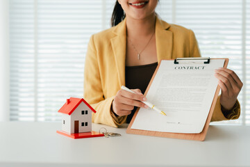 Portrait of a Home Purchase Agreement
Real estate agent delivers a model home to a client, mortgage, loan, lease-purchase agreement, and home sale.