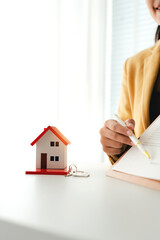 Portrait of a Home Purchase Agreement
Real estate agent delivers a model home to a client, mortgage, loan, lease-purchase agreement, and home sale.