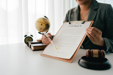 Female consultant or lawyer working in office. Legal concept. Justice and legal advice. Male judge in courtroom.