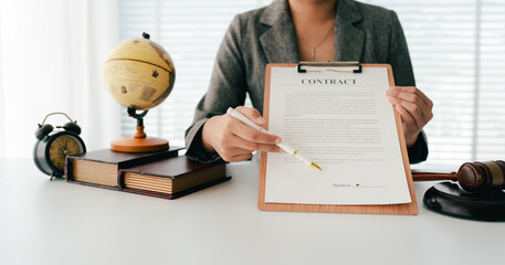 Female consultant or lawyer working in office. Legal concept. Justice and legal advice. Male judge in courtroom.