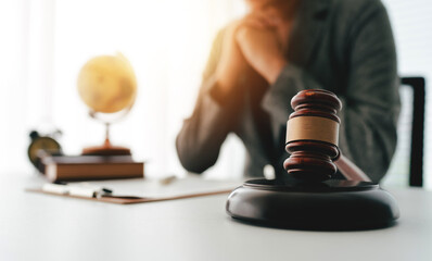 Close-up focuses on judge's hammer on lawyer's table Male consultant or lawyer working in the...