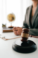 Close-up focuses on judge's hammer on lawyer's table Male consultant or lawyer working in the office Legal concepts, advice