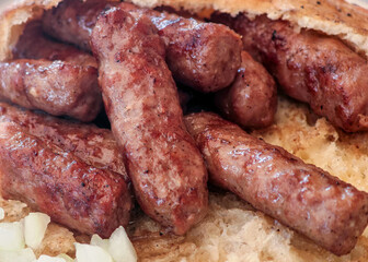 A flatbread with cevapi-cevapcici, a symbol of delicious Balkan cuisine.