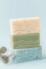 Natural handmade soap bar stacked with green, beige, and blue colors, decorative design