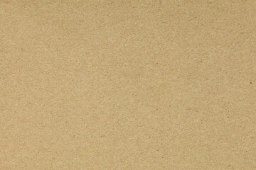Brown craft paper texture background. High-resolution cardboard surface with fibrous detail for vintage design, packaging mockups, or as a natural, recycled wallpaper overlay.
