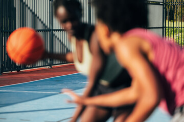 Basketball players in action on outdoor court