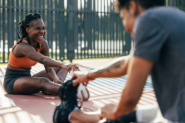 Friends enjoying outdoor exercise and stretching