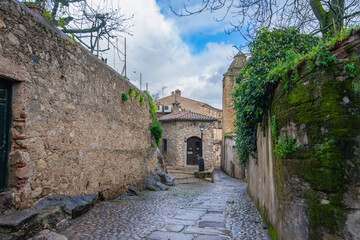 Discover the historic charm of Trujillo Spain with this picturesque narrow street, lined with...