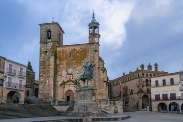 A majestic bronze equestrian statue of Pizarro graces Trujillo Square, Spain, with historic stone...