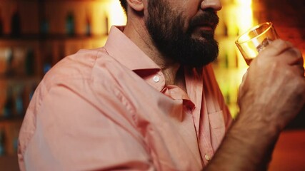 Lonely man drinking whiskey in bar, dealing with stress and possible alcoholism