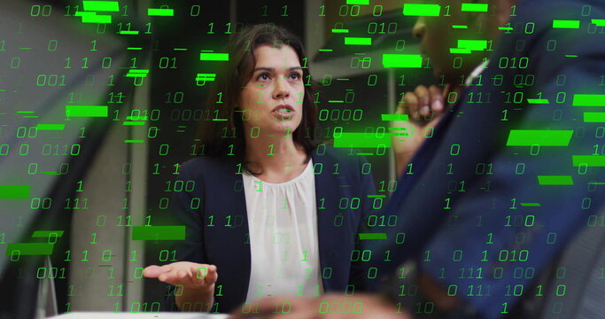 Gesturing woman in dark blazer speaking at conference table with smartphone and binary code overlay