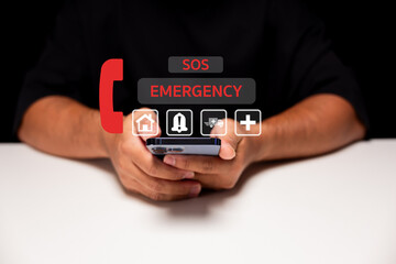 A person holds a smartphone displaying emergency icons including SOS, alert, medical, and home,...