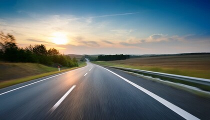Naklejka premium blurred rural highway seen from moving car at dusk