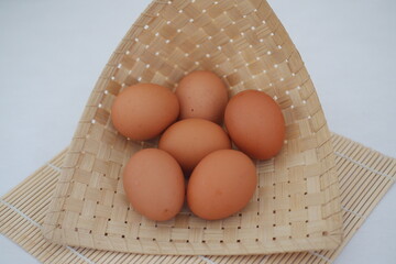Brown Eggs in Traditional Bamboo Basket