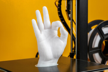 PLA filament used in desktop printer to produce life-sized human hand model, 3D printing evolution...