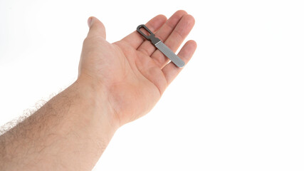 Fototapeta premium Hand holding a small tool on white