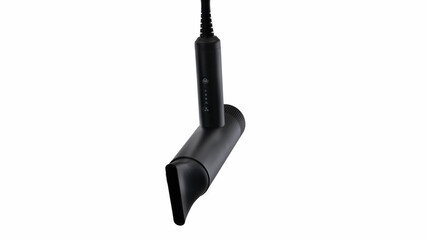 Modern black hair dryer hanging on a wall