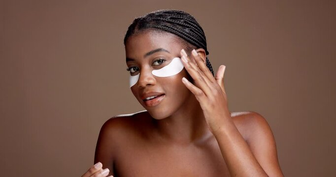 Woman, eye patch and beauty with face in studio for dark circles, cosmetics or hydration on brown background. African girl, model and portrait with space for dermatology, skincare pad or benefit