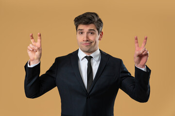 Skeptic Businessman With Hands Two Fingers Air Quotes On Beige, Sarcasm,cynicism