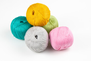 knitting yarn balls, crochet thread of many colors on a white background, skeins of yarn, clews...