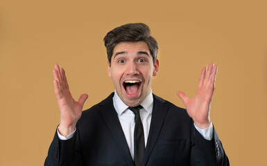 Handsome mature businessman reacts with amazed expression, says wow, open mouth