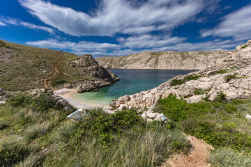 The picturesque bay and pebbly empty beach of Gnjilova on the island of KRK,