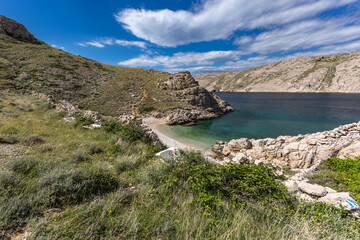 The picturesque bay and pebbly empty beach of Gnjilova on the island of KRK,