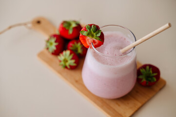 Strawberry smoothie with fresh strawberries, refreshing summer drink for hot days
