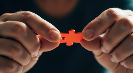Holding a blue jigsaw piece, hands connect for business teamwork and a strategic solution