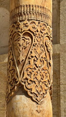 Beautifully carving wooden column in the ancient mosque in Bukhara, Uzbekistan