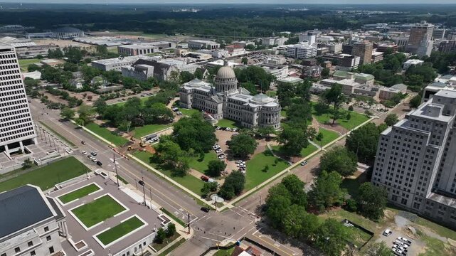 Jackson, Mississippi state Capitol building with dome architecture and other city government buildings in downtown skyline