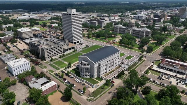 Jackson, Mississippi state Capitol building with dome architecture and other city government buildings in downtown skyline