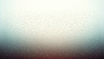 Obraz premium Water droplets on a frosted window, fading from light gray to dark red-brown