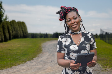African American Woman Using Tablet Technology Outdoor Business Work