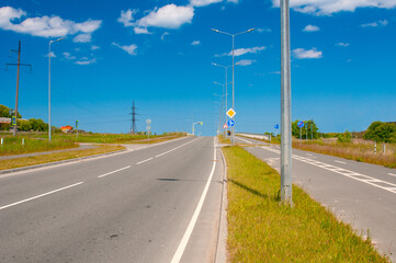 Bike path in country near roadway in summer