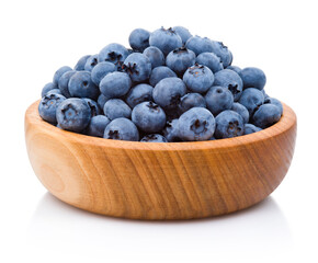 Fresh blueberries on wooden bowl isolated on white background