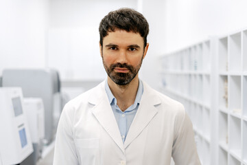 Fototapeta premium Portrait of serious doctor standing in hospital laboratory