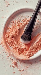 Crushed Coral Powder Makeup with Brush on a Clean White Background Perfect for Enhancing Your Natural Beauty and Achieving a Flawless Look