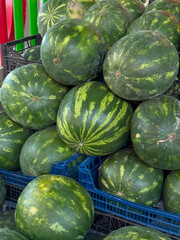 Rustic Wooden Cart Loaded with Watermelons and Cantaloupes