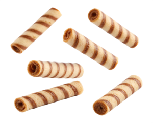 brown striped wafer rolls floating falling, isolated PNG transparent background