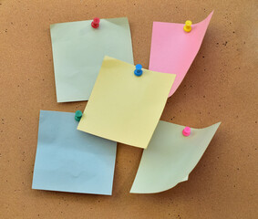 many colorful flyer falling cork wall