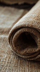 Creamy Linen Fabric Texture Close-Up Showing Rolled Spiral Creases in Detail for Textile Design Inspiration