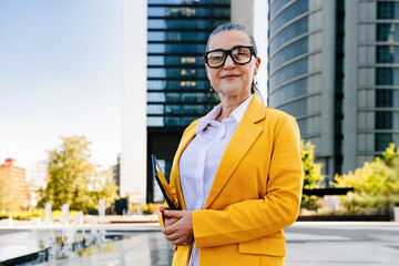 Senior businesswoman wearing business casual attire in the city