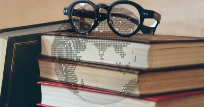 On second five round black eyeglasses sliding onto book stack, dotted globe rotating over for study