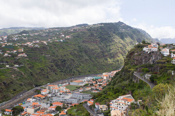 Beautiful view of the city and mountains on a summer day. Top view. Ribeira Brava. Madeira. Portugal.