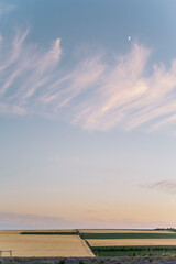 Vast rural landscape under blue sky at dusk