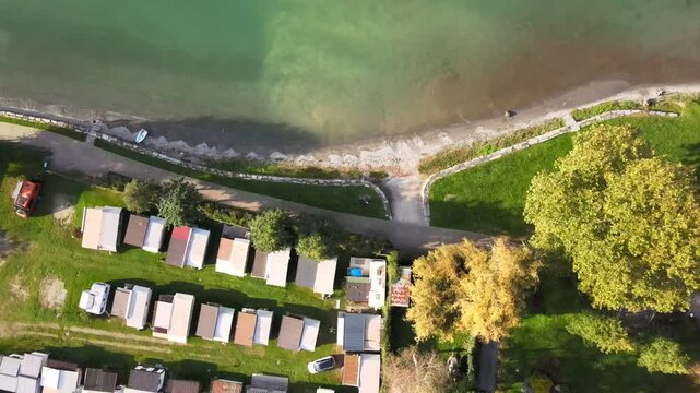 Aerial nature top down of Colico village in Lake Como Italian Alps during fall in Lombardy