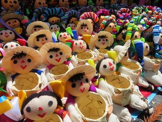 traditional handmade mexican colorful dolls in a market