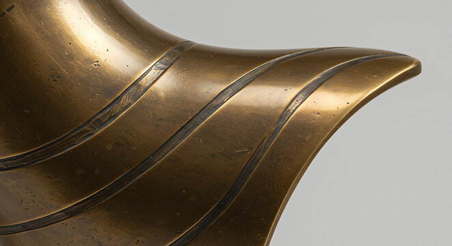 Abstract bronze sculpture with curved lines and polished finish  
