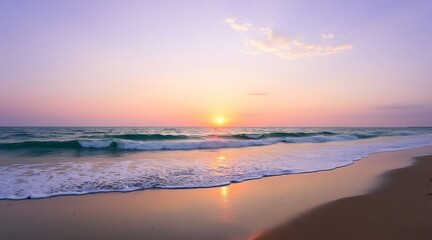 Obraz premium Ocean waves gently wash onto a sandy beach during a pastel sunset image